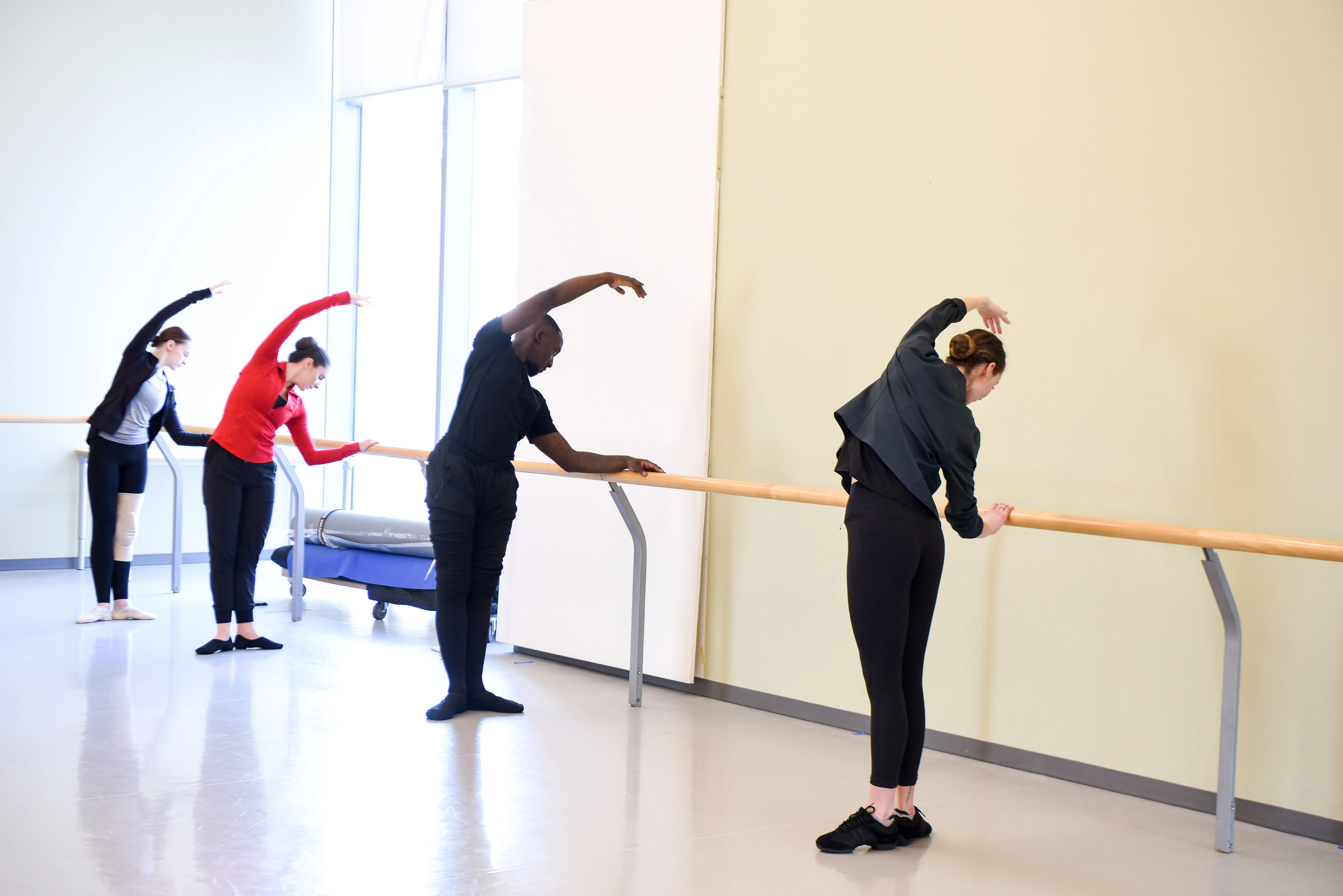 Aspiring dance teachers participate in a ballet class