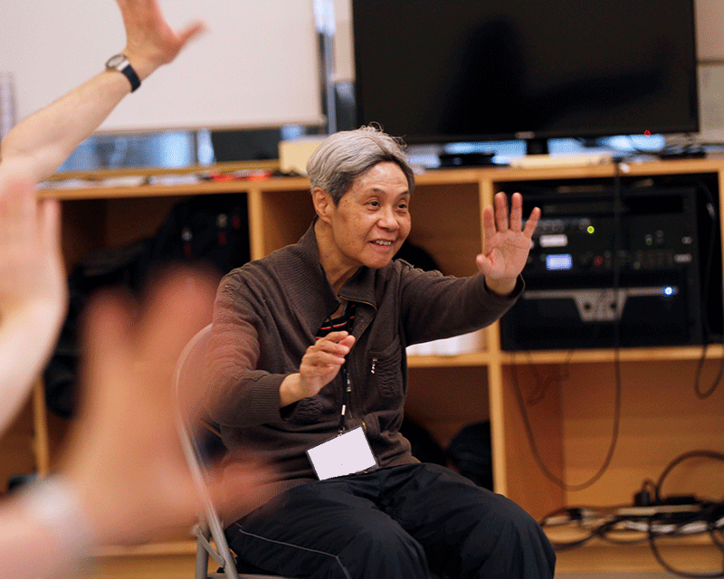 A dancer participates enthusiastically in a sharing dance parkinson's class