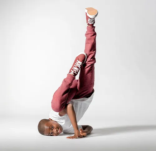 A young dancer expresses himself through movement.
